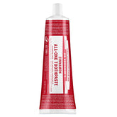 Dr. Bronner's Cinnamon Red and white toothpaste tube with text on a white background