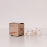 Routine Blackberry Betty mini deodorant showing brown cardboard packaging box next to open glass jar containing cream