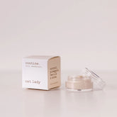 Routine Cat Lady vegan deodorant mini - cream cardboard box beside open glass jar showing light cream deodorant