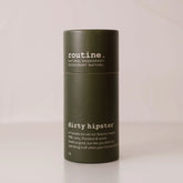 Routine Dirty Hipster natural deodorant in signature olive green cardboard tube with minimalist branding on a beige background