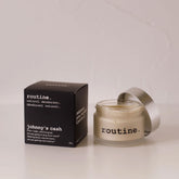 Routine Johnny's Cash vegan natural deodorant - glass jar with cream deodorant beside black packaging highlighting beeswax-free formula with cedar and pine scent for plant-based lifestyles