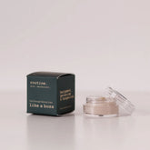 Routine Like A Boss mini deodorant - dark green cardboard box with opened glass jar showing cream-coloured deodorant