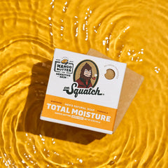 Dr Squatch Mango Butter soap bar on a yellow textured background