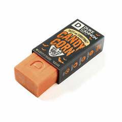 Orange soap bar with a black box labeled 'Duke Cannon Candy Corn' on a white background