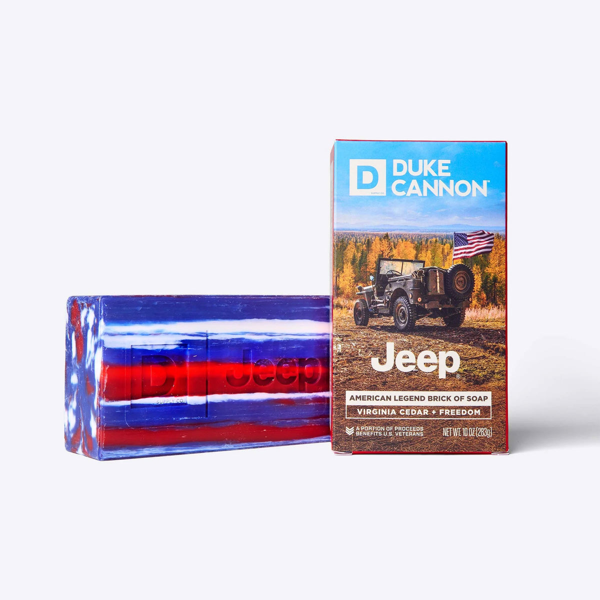  Duke Cannon Jeep American Legend brick of soap shown beside its Virginia Cedar packaging box featuring a vintage Jeep and American flag