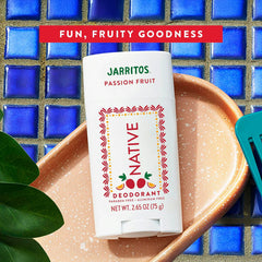Native Jarritos Passion Fruit deodorant on a ceramic plate with a blue tiled background