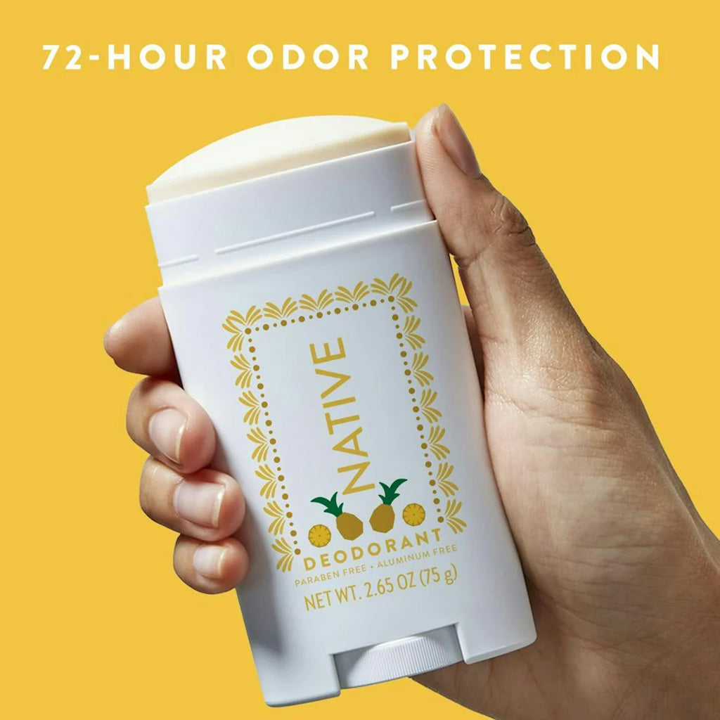 Hand holding a Native Pineapple deodorant stick with '72-Hour Odor Protection' text on a yellow background