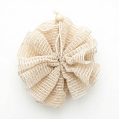 Beige bath pouf on a white background