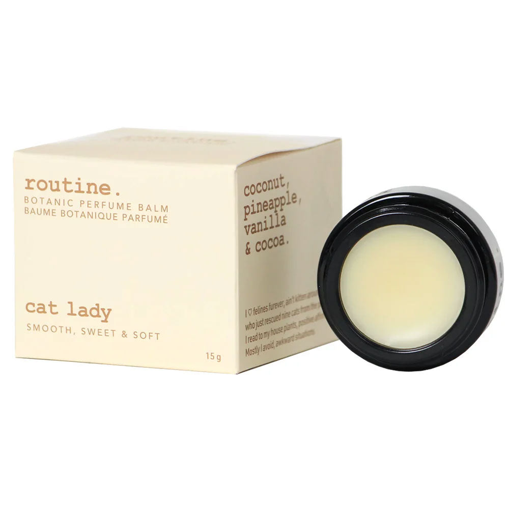 Routine Cat Lady solid perfume - cream packaging box with tropical scent description and black jar showing smooth balm texture - 15g botanical perfume balm
