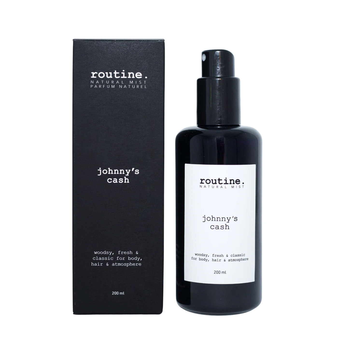 Routine Johnny's Cash Natural Mist - detailed product view showing black spray bottle with white label next to black packaging displaying woodsy fresh classic fragrance description for masculine daily use