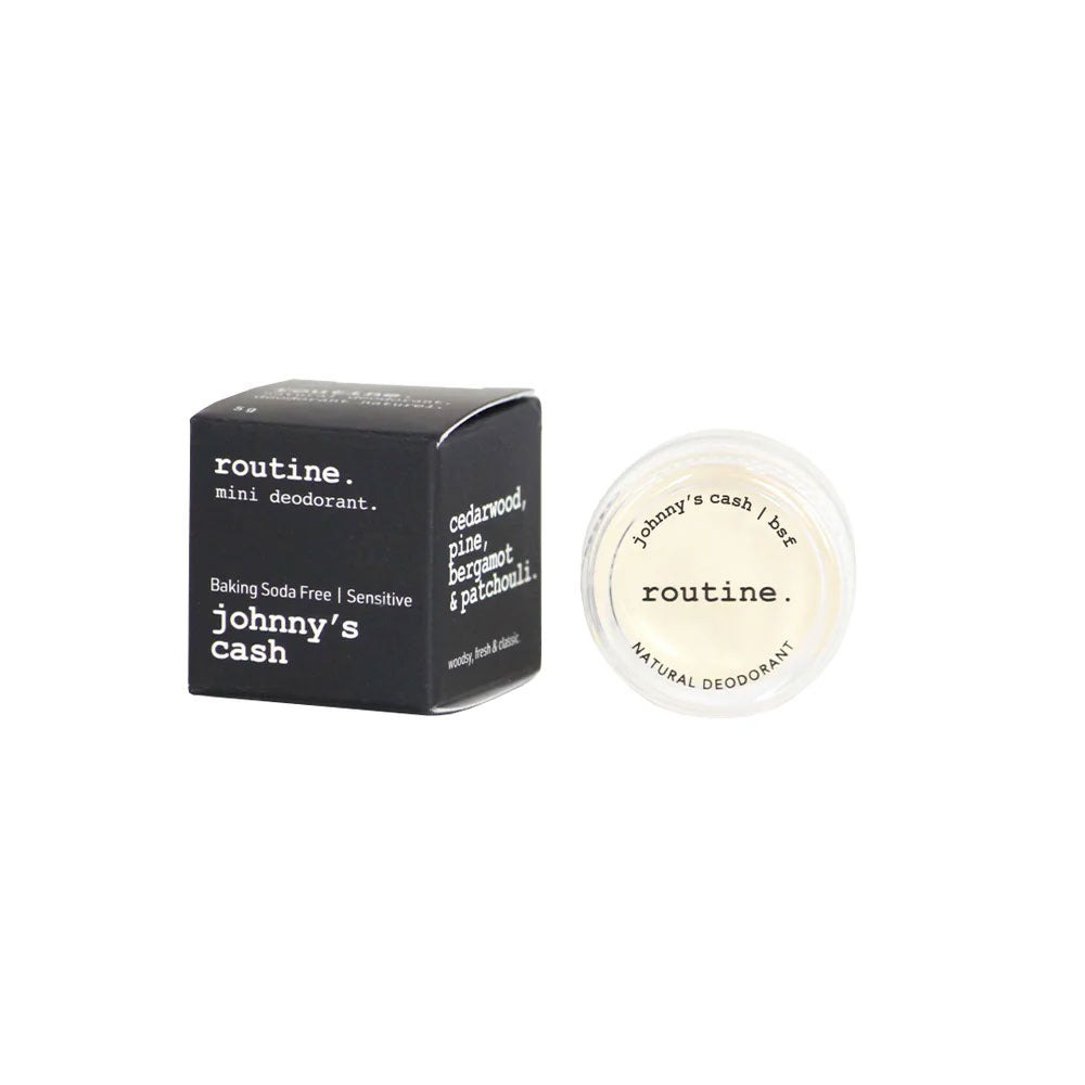 Routine Johnny's Cash mini deodorant with opened jar displaying "johnny's cash / bsf" and "routine NATURAL DEODORANT" text on white lid showing woodsy baking soda free formula