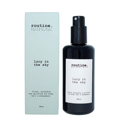Routine Lucy in the Sky Natural Mist - front view of black glass bottle with pump dispenser and clean white label