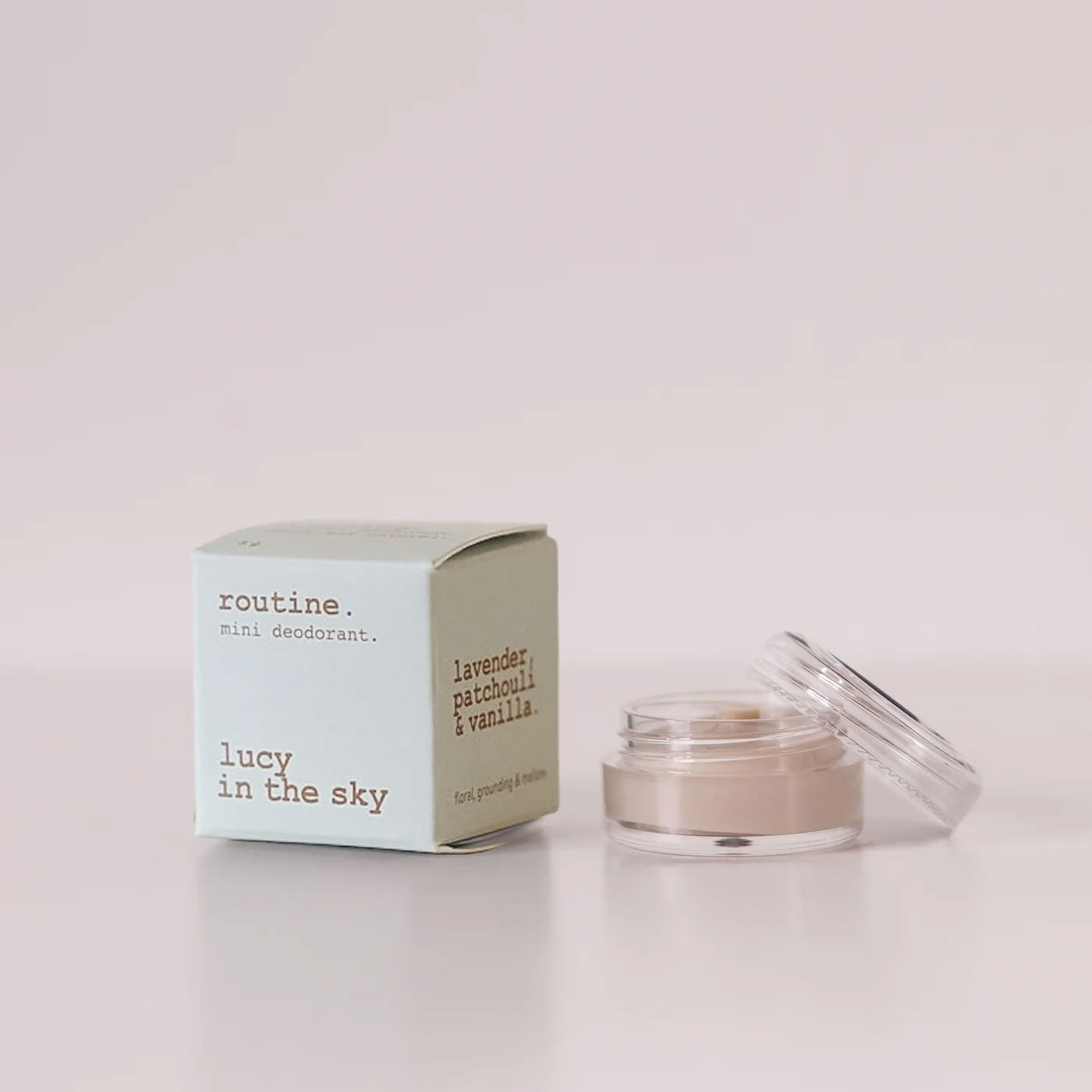 Routine Lucy in the Sky vegan mini deodorant - soft mint green cardboard box with opened glass jar showing cream-coloured deodorant - beeswax-free formula with lavender patchouli and vanilla aromatherapy blend
