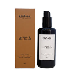Routine Reuben & the Desert Natural Mist - close-up view of black glass bottle with pump dispenser and minimalist white label