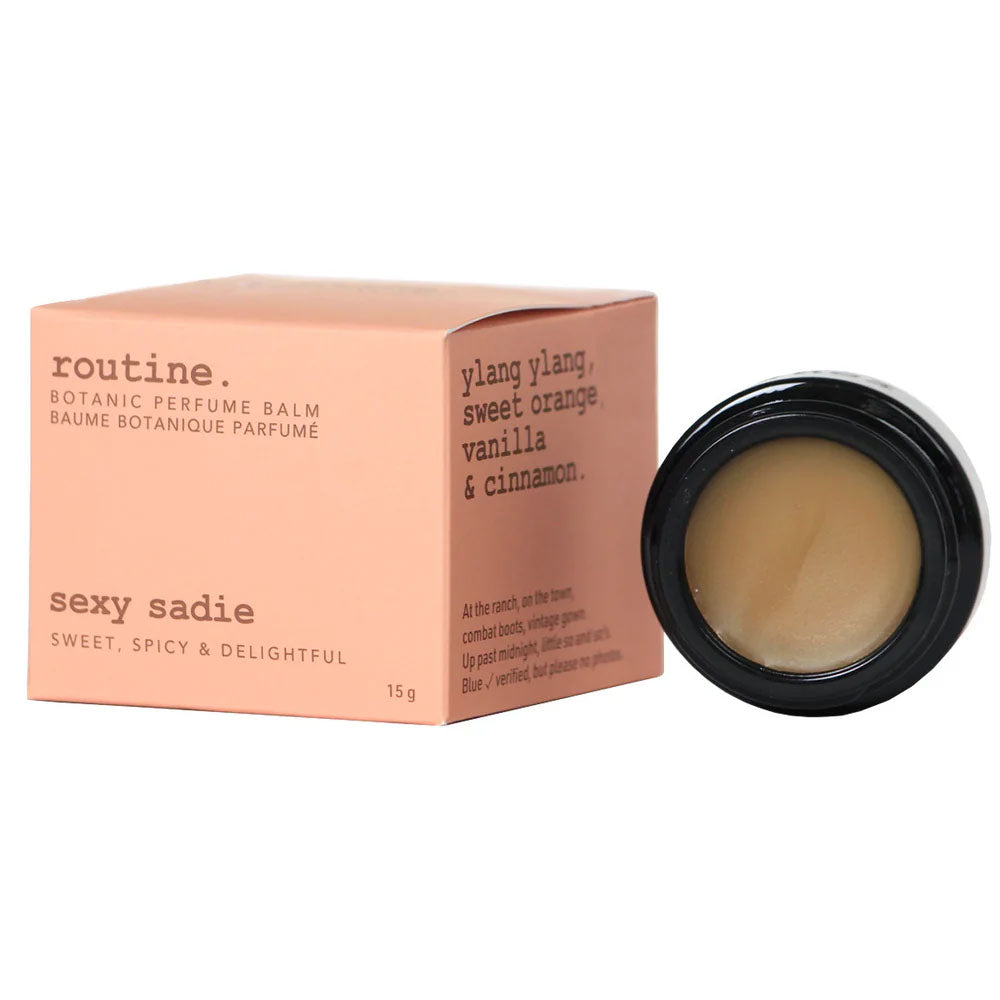Routine Sexy Sadie solid perfume - coral-pink packaging box with exotic scent description and black jar showing smooth balm texture - 15g botanical perfume balm