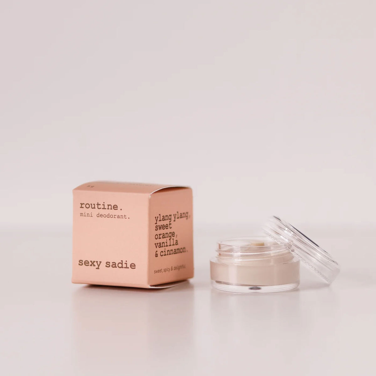 Routine Sexy Sadie vegan mini deodorant - coral pink cardboard box with opened glass jar showing cream-coloured deodorant