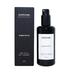 Routine Superstar Natural Mist - close-up view of sleek black spray bottle with white minimalist label displaying product name and volume - premium natural fragrance mist for versatile use