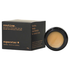 Routine Superstar solid perfume - black packaging box with warm scent description and black jar showing smooth balm texture