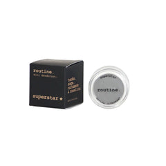 Routine Superstar mini deodorant with opened jar displaying "superstar" and "routine NATURAL DEODORANT" text on white lid showing premium cult-favourite formula