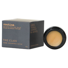 Routine The Class solid perfume - grey packaging box with warm scent description and black jar showing smooth balm texture