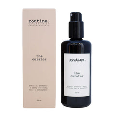 Bottle and packaging of 'routine.' natural mist with 'the curator' label on a white background.