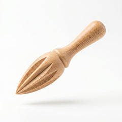 Wooden citrus press on a white background