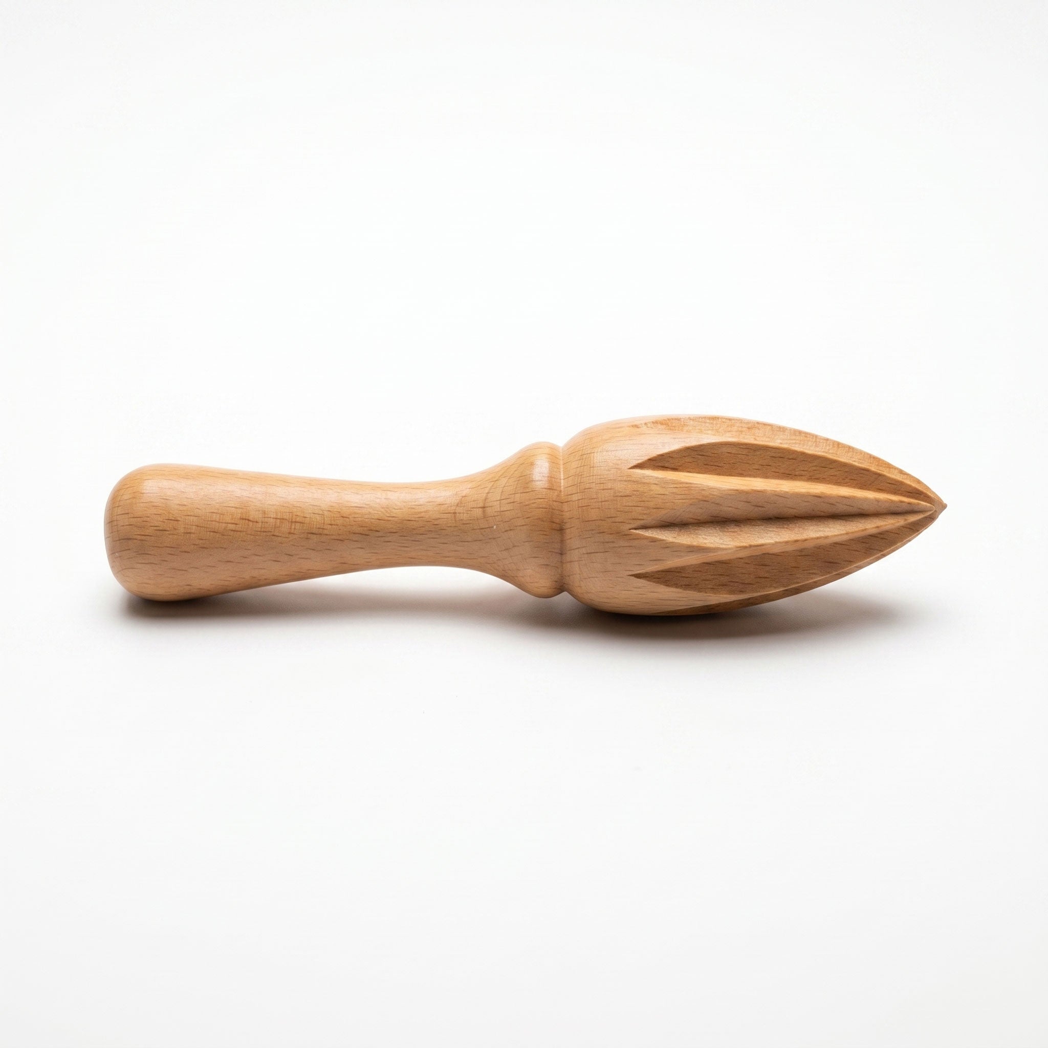 Hand-carved beechwood lemon squeezer with ridged conical head and turned handle on white background